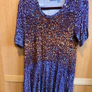 Logo Peplum purple short sleeve top, size M.